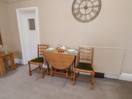 A dining room with a table set for breakfast at Time Out in Whitby