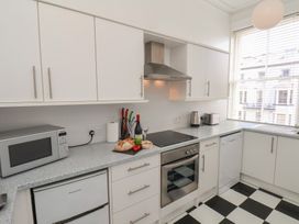 A kitchen with appliances and food items at Time Out in Whitby