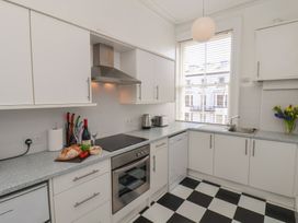A kitchen with appliances and food items at Time Out in Whitby