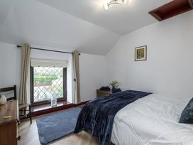 A bedroom with a bed and window at Preswylfa