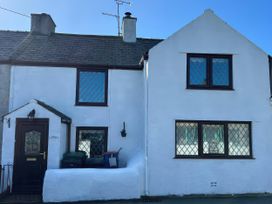A house with windows and a door at Preswylfa in Tregele near Cemaes Bay