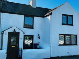 A house exterior with windows and a door at Preswylfa, Tregele near Cemaes Bay
