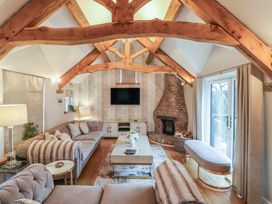 A living room with a sofa and a coffee table at Mill Race Cottage in Driffield