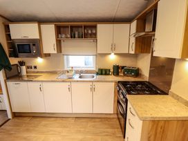 A kitchen with a sink and cooker at 108 Fox Burrow Hang Great Yarmouth