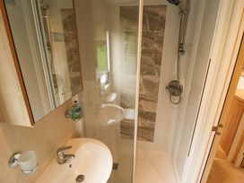 A bathroom with a shower and sink at 108 Fox Burrow Hang in Great Yarmouth