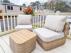 A seating area with chairs and a table at 108 Fox Burrow Hang Great Yarmouth