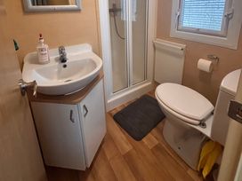 A bathroom with a sink and a shower at 18 Fallows Fall in Leven
