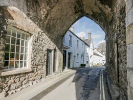 An archway with buildings and a road at Linden Lea in Grange-Over-Sands