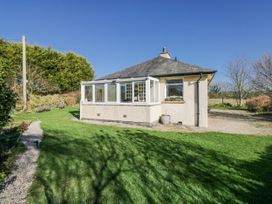 A bungalow exterior with a garden and pathway at Linden Lea Field Broughton near Cartmel