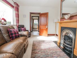 A living room with a sofa and fireplace at Linden Lea Field Broughton near Cartmel