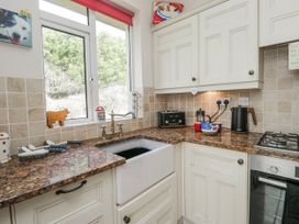 A kitchen with a sink and stove at Linden Lea Field Broughton near Cartmel