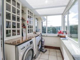 A laundry room with washing machine and dryer at Linden Lea Field Broughton near Cartmel