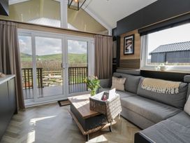 A living room with a sofa and coffee table at Daverneithon 4 near Llandrindod Wells