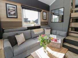 A living room with a sofa and coffee table at Daverneithon 4 near Llandrindod Wells