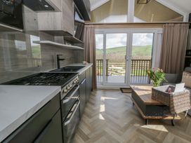 A kitchen with a stove and sink at Daverneithon 4 near Llandrindod Wells