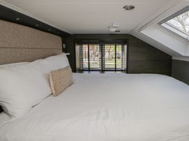 A bedroom with a bed and window at Daverneithon 4 near Llandrindod Wells