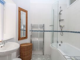 A bathroom featuring a sink, bathtub, and shower at Lukesland Wing Ivybridge