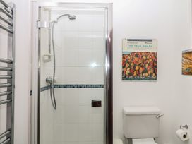 A bathroom featuring a shower and toilet at Lukesland Wing in Ivybridge