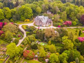 A mansion surrounded by gardens and trees at Lukesland Wing near Ivybridge