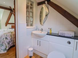 A bathroom with a sink and toilet at The Coach House in Dorchester