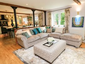 A living room with a sofa and coffee table at The Coach House near Charminster