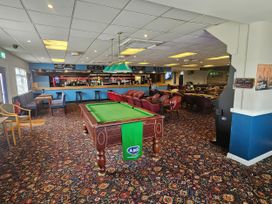 A bar area with a pool table and seating at Salt Air 130 @ Park Ave Holiday Village Leysdown-On-Sea, Kent