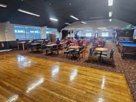A bar area with tables and chairs at Salt Air 130 @ Park Ave Holiday Village, Leysdown-On-Sea, Kent