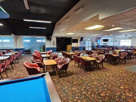 A bar with seating and a pool table at Salt Air 130 @ Park Ave Holiday Village in Leysdown-On-Sea, Kent