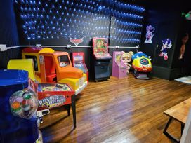A game room with arcade machines and a toy truck at Salt Air 130 @ Park Ave Holiday Village, Leysdown-On-Sea, Kent