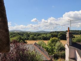 A view of fields and mountains from a property at The Cottage in Sampford Courtenay