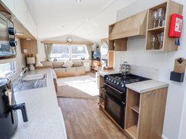 A kitchen with a countertop and appliances at 75 Morpeth Mews Wooler