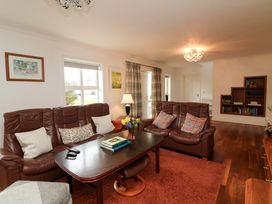 A living room with a sofa and coffee table at Sunnyside in River Chapel