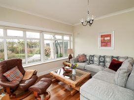 A living room with a sofa and coffee table at Sunnyside in River Chapel