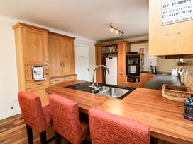 A kitchen with a sink and appliances at Sunnyside in River Chapel