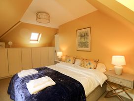A bedroom with bed and wardrobe at Sunnyside in River Chapel
