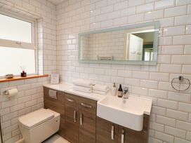 A bathroom with a sink and toilet at Sunnyside in River Chapel