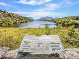 A lake view with a plaque in foreground at Trwyn Cam near Brynrefail near Llanberis