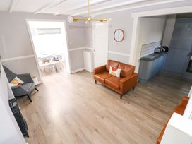 A living room with a sofa and chair at The Wool Pack in Tenby