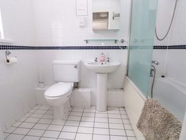 A bathroom with a toilet and sink at The Wool Pack in Tenby