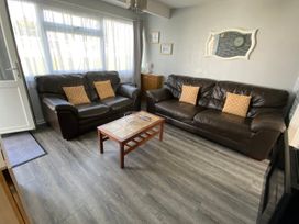 A living room with sofas and a coffee table at Chalet 57, California, Norfolk