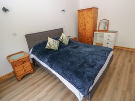 A bedroom with a bed and furniture at Brookview Goldfinch in Haverfordwest