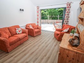 A living room with sofas and a coffee table at Brookview Goldfinch in Haverfordwest