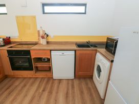 A kitchen with appliances and countertops at Brookview Goldfinch in Haverfordwest