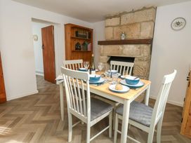 A dining room with a table set for a meal at NO 10 Fortuneswell
