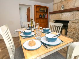 A dining room with a table set for a meal at NO 10 Fortuneswell
