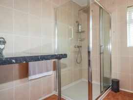 A bathroom with a shower and sink at Tregoning annex in Lerryn near Lostwithiel