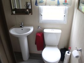 A bathroom with a sink and toilet at Kent Coast Holiday Park - Holiday Accommodation 22252, Rochester, Kent