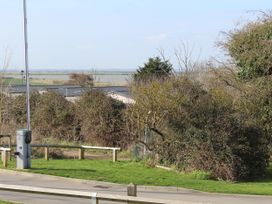 An outdoor view with bushes and a fence at Kent Coast Holiday Park - Holiday Accommodation 22252, Rochester, Kent