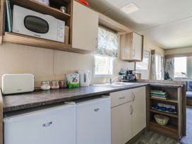 A kitchen with appliances on the counter at Estuary View in Allhallows