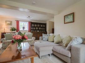A living room with sofa and lamp at Harbins Farm Glanvilles Wootton Nr. Sherborne
